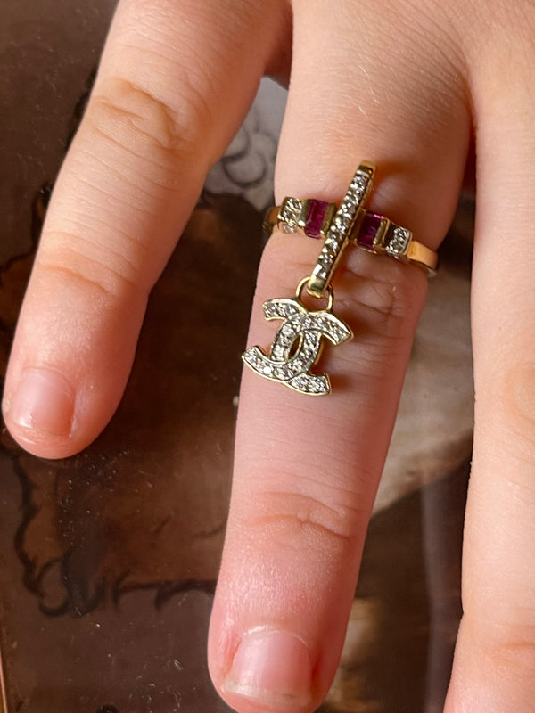CHANEL dangle ring with diamonds and rubies set an 18 karat gold.