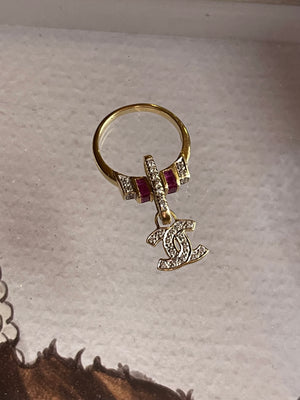 CHANEL dangle ring with diamonds and rubies set an 18 karat gold.