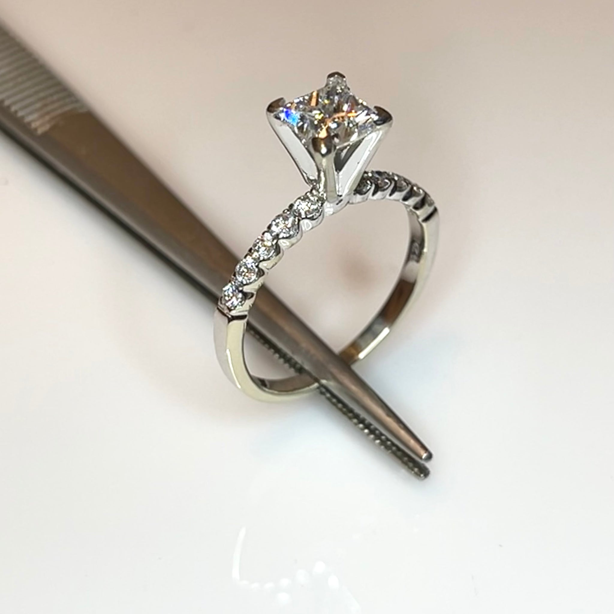 Tiffany set solitaire princess cut diamond engagement ring