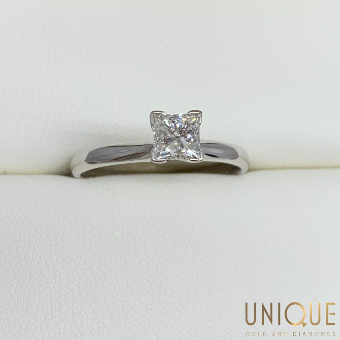 One Lady's 14 Karat White Gold Solitare Engagement Ring With A